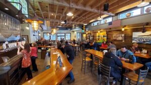 Craft beer flight and gourmet burger at Kenai River Brewing Company in Soldotna, Alaska.
